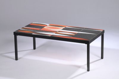 a black table with orange and white designs on it