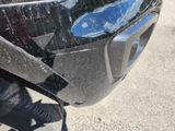 a close up of a motorcycle with a broken front bumper