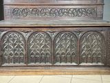 a wooden chest with carvings on it in a room