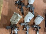 many different types of airbrushs on a table