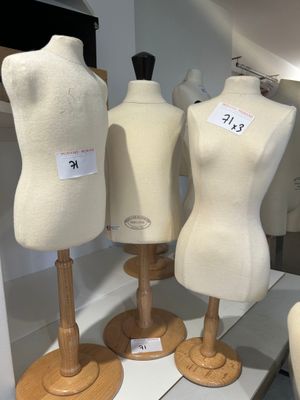several mannequins are on display in a display case