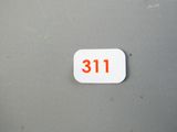 un bouton blanc portant le chiffre 31