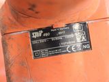 a close up of an orange fire hydrant with a sticker on it