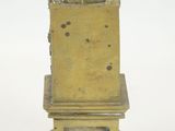 a statue of a man sitting on top of a chair