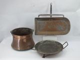 two pots and a pan sitting on a table