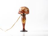 a lamp that is sitting on a table with a cord attached to it