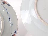 two plates that are sitting next to each other on a table