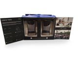 two shot glasses in a box with a picture of a man doing a trick