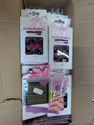 boxes of nail polish and false nails are stacked on top of each other
