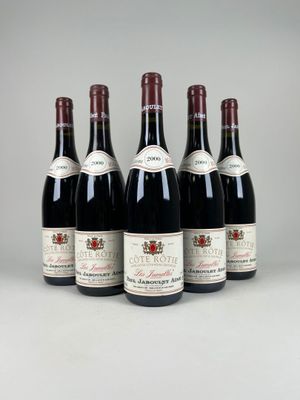 six bottles of wine are lined up in a row