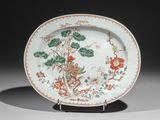 an image of a plate with flowers and birds painted on it