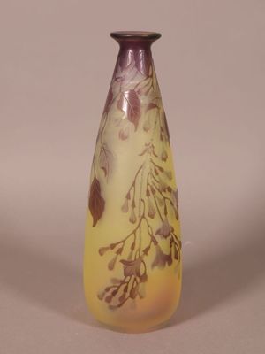 a vase with a yellow and purple design on it