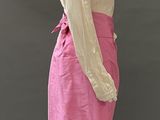 mannequin wearing a pink skirt and white blouse on a mannequin mannequin mannequin mannequin mannequin mannequin manne