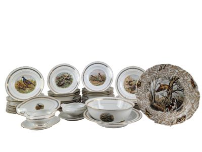 a lot of plates and bowls that are sitting on a table
