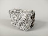 a rock that is sitting on a white surface