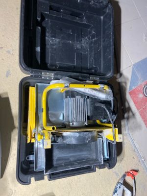 a tool box that has a tool in it on the floor