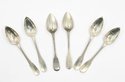 six silver spoons are arranged in a row on a white surface