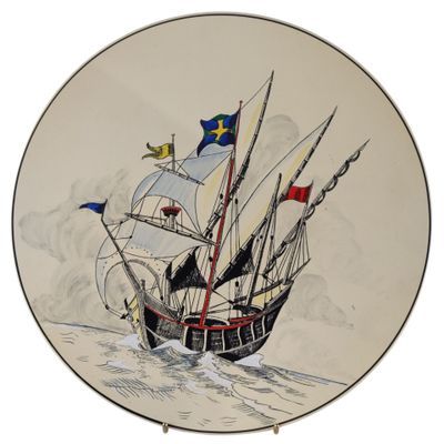 a plate with a painting of a ship in the water