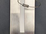 a metal object with a wire attached to it