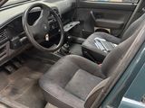 the interior of a car with the door open and the steering wheel down
