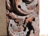 a wooden carving on the side of a building