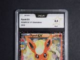 a close up of a pokemon card on a black surface
