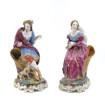 pair of porcelain figurines of a woman and a dog