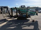 a picture of a crane that is parked in a parking lot