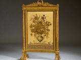 a gold frame with a painting of flowers on it