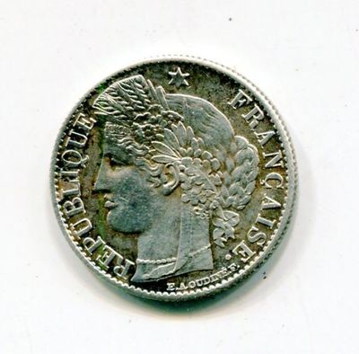 a close up of a coin with a woman ' s head on it