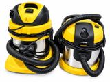two yellow and black vacuums sitting next to each other on a white surface