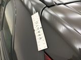 a sticker on the back of a car with a price tag attached to it