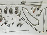 a picture of a collection of silver jewelry on a table