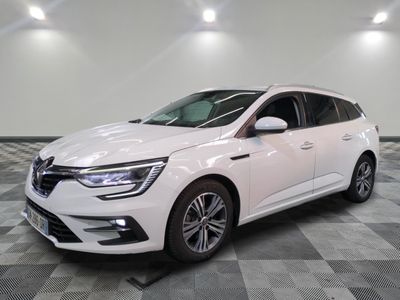 the white car is parked in a large room with checkered floor