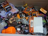a cardboard box filled with various items for halloween