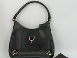 black leather handbag with gold hardware and matching wallet