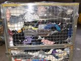 a metal cart with many items in it in a warehouse