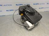 a close up of a small engine on a table in front of a wall