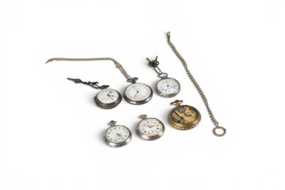 many different types of pocket watches on a white surface