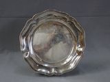 a silver plate that is sitting on a table
