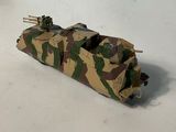 a toy tank that is sitting on a white surface