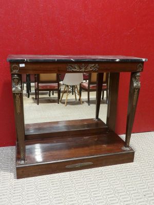 an old wooden table with a mirror on top of it