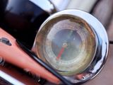 a close up of a bike handlebar with a speedometer on it