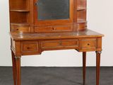 an image of a desk with a mirror on top of it