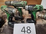 two cordless drillets are sitting on a table with a price tag