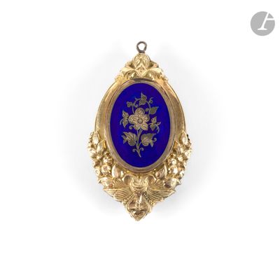 an image of a gold and blue pendant with flowers on it