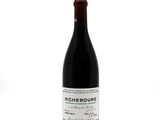 a bottle of wine that is sitting on a table