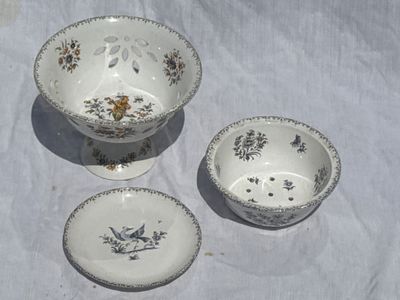 three bowls and a bowl sitting on a table