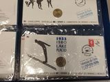 four commemorative coins are in plastic bags on a table