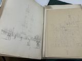 an open book with a drawing of a building on it